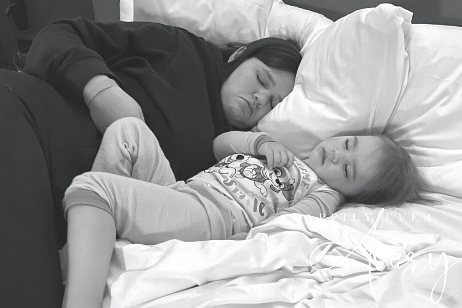 mom and big sis sleeping at hotel