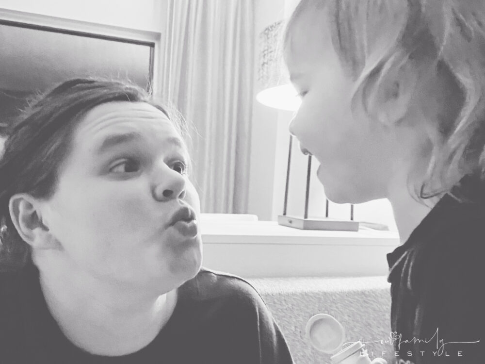 mom and toddler making silly faces